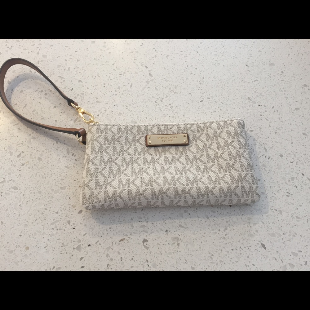 Michael Kors cream wristlet.